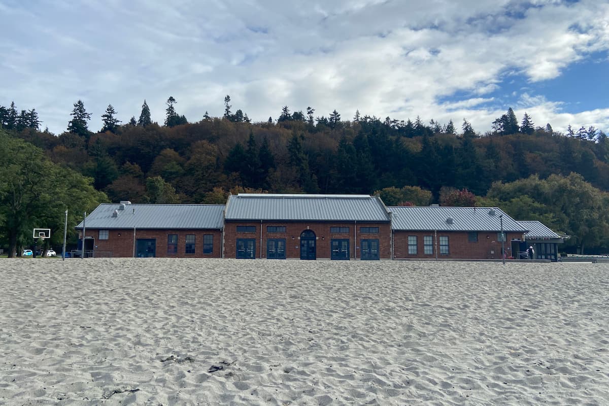The public restrooms are located on the sides of the community building next to the parking lot and beach volleyball courts.